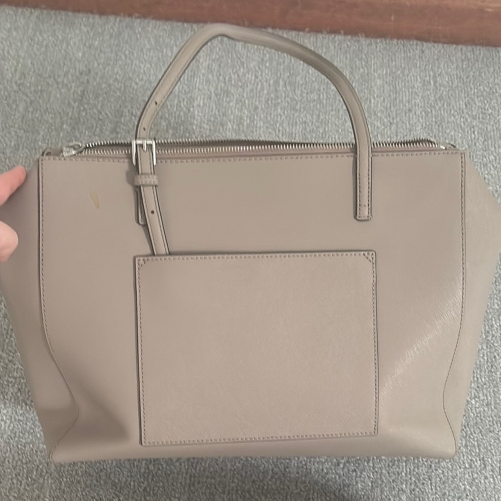 Tory Burch Gray Leather Tote Bag
EUC
Has a litter stain inside - Picture 6 of 8